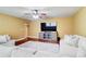 Inviting living room features a large TV, comfortable seating, and a ceiling fan at 116 Archstone Sq, Mcdonough, GA 30253
