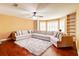 Spacious living room with plush, neutral sectional sofa, accent pillows and a shaggy rug at 116 Archstone Sq, Mcdonough, GA 30253