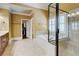 Elegant bathroom features a soaking tub, separate shower, and access to the walk-in closet at 116 Archstone Sq, Mcdonough, GA 30253