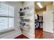 Organized walk-in closet offers custom shelving and ample space for shoes and clothing at 116 Archstone Sq, Mcdonough, GA 30253