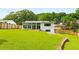 Expansive backyard with lush green grass and a sunroom addition perfect for relaxation or entertaining at 1981 Shalimar Ne Dr, Atlanta, GA 30345