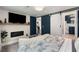 This cozy bedroom features a decorative fireplace, and ensuite bathroom with white sliding door at 1981 Shalimar Ne Dr, Atlanta, GA 30345