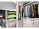 Bedroom and walk-in closet combination featuring hardwood floors and plenty of natural light at 1981 Shalimar Ne Dr, Atlanta, GA 30345