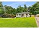 Charming single-story home with a well-manicured front yard, carport, and inviting curb appeal at 1981 Shalimar Ne Dr, Atlanta, GA 30345