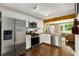 Modern kitchen features stainless steel appliances, hardwood floors, and a connected living space at 1981 Shalimar Ne Dr, Atlanta, GA 30345