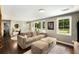 Comfortable living room with hardwood floors, plush seating, and abundant natural light at 1981 Shalimar Ne Dr, Atlanta, GA 30345