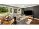 Modern living room with hardwood floors, plush seating, and a contemporary entertainment center at 1981 Shalimar Ne Dr, Atlanta, GA 30345