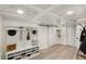 Bright mudroom boasts custom built-ins, bench seating, and storage paired with a sliding barn door at 1981 Shalimar Ne Dr, Atlanta, GA 30345