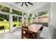 Sunroom with large windows, tile flooring, and a dining area with bench seating at 1981 Shalimar Ne Dr, Atlanta, GA 30345