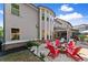 Well-maintained backyard with manicured lawn, fire pit, and lush landscaping at 5157 Sunlake Dr, Hoschton, GA 30548