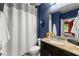 Stylish bathroom features a vanity with a granite countertop, a shower, and a toilet at 5157 Sunlake Dr, Hoschton, GA 30548