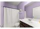 Hall bath featuring a shower and modern vanity at 5157 Sunlake Dr, Hoschton, GA 30548