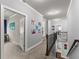 Hallway with gray walls, white trim, carpeted floors, and beautiful trim at 5157 Sunlake Dr, Hoschton, GA 30548