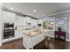 Kitchen features granite countertops, stainless steel appliances, and white cabinetry at 5157 Sunlake Dr, Hoschton, GA 30548