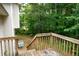 Wooden back deck of home overlooking lush greenery at 52 Tide Water Way, Rockmart, GA 30153