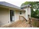 Exterior view of home with back deck, siding and lush greenery at 52 Tide Water Way, Rockmart, GA 30153