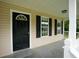 Inviting front porch showcasing black front door, neutral siding, white trim, and pleasant natural light at 52 Tide Water Way, Rockmart, GA 30153