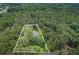 Secluded home nestled within a natural forest with a defined property line, providing privacy and a sense of tranquility at 83 Shipp Cir, Hiram, GA 30141