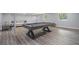 Finished basement with a stylish pool table, light wood flooring, and comfortable seating, perfect for entertaining at 83 Shipp Cir, Hiram, GA 30141