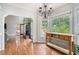 Cozy dining area with hardwood floors, stylish lighting, and serene views at 83 Shipp Cir, Hiram, GA 30141