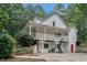 Charming two-story home with white siding, a full-length porch, and a basketball hoop for outdoor activities at 83 Shipp Cir, Hiram, GA 30141