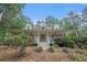 Inviting home with a large covered porch, manicured landscaping, and a peaceful atmosphere at 83 Shipp Cir, Hiram, GA 30141