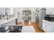 Modern kitchen with white cabinets, stainless steel appliances, and ample counter space at 83 Shipp Cir, Hiram, GA 30141