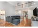Spacious living room with high ceilings, hardwood floors, and plenty of natural light at 83 Shipp Cir, Hiram, GA 30141