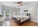 Light-filled main bedroom with hardwood floors and two large windows at 83 Shipp Cir, Hiram, GA 30141