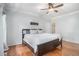 Light-filled main bedroom with hardwood floors and two large windows at 83 Shipp Cir, Hiram, GA 30141