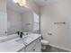 Bathroom with modern vanity, large mirror, and combination tub and shower at 1666 Baxley Pine Trce, Suwanee, GA 30024