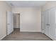 Bedroom with neutral walls, wood-look flooring, and walk-in closet at 1666 Baxley Pine Trce, Suwanee, GA 30024