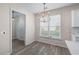 Bright breakfast area features natural light from a large window, and adjacent access to the kitchen at 1666 Baxley Pine Trce, Suwanee, GA 30024