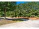 Long driveway to a treelined property at 1666 Baxley Pine Trce, Suwanee, GA 30024