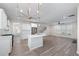 Open floor plan showcasing the kitchen, living, and dining areas that are ideal for modern living at 1666 Baxley Pine Trce, Suwanee, GA 30024