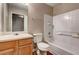 Traditional bathroom features a tub with tile surround, vanity and toilet at 2289 Strathmoor Manor Dr, Lithonia, GA 30058