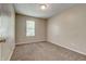 Neutral bedroom with carpet flooring and single window at 2289 Strathmoor Manor Dr, Lithonia, GA 30058