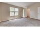 Spacious bedroom with carpet flooring, natural light, and walk-in closet at 2289 Strathmoor Manor Dr, Lithonia, GA 30058