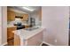 An eat-in kitchen features light wood cabinets, stainless steel appliances and plenty of counter space at 2289 Strathmoor Manor Dr, Lithonia, GA 30058