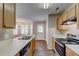 An eat-in kitchen features light wood cabinets, stainless steel appliances and plenty of counter space at 2289 Strathmoor Manor Dr, Lithonia, GA 30058