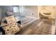 Attic featuring neutral decor and luxury vinyl plank floor at 3046 Dobbs Way, East Point, GA 30344