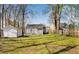 Spacious backyard with grass and multiple storage sheds at 3046 Dobbs Way, East Point, GA 30344