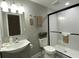 Updated bathroom with a shower over the toilet, modern sink, and stylish design at 3046 Dobbs Way, East Point, GA 30344