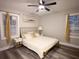 Comfortable bedroom with a cozy atmosphere, two windows for natural light and vinyl floor at 3046 Dobbs Way, East Point, GA 30344
