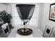 Dining area featuring gray table, decor, blinds, and a sheer black curtain at 3046 Dobbs Way, East Point, GA 30344