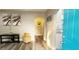 An open entryway reveals a stylish living room with new wood floors and contemporary decor at 3046 Dobbs Way, East Point, GA 30344