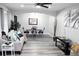 Bright living room and dining area featuring modern gray flooring and contemporary decor at 3046 Dobbs Way, East Point, GA 30344