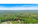 Aerial view showing property near lush green wooded area at 345 Riverstone Dr, Hiram, GA 30141
