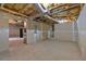 Unfinished basement space with exposed insulation and concrete flooring at 345 Riverstone Dr, Hiram, GA 30141