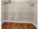 Walk-in closet featuring a wood floor, white wire shelving and base molding at 345 Riverstone Dr, Hiram, GA 30141